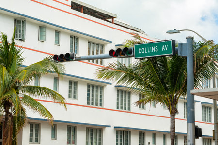 Cityscape view of beautiful Miami Beach along Collins Avenue with palm trees and art deco architecture.のeditorial素材