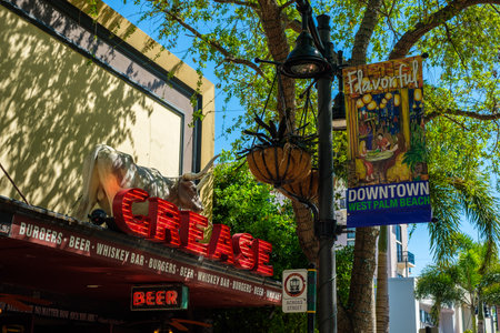 West Palm Beach, Florida - March 14, 2018: Cityscape view of the the popular West Palm Beach downtown district with restaurants and retail stores along Clematis Street.のeditorial素材