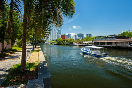 Miami, Florida USA - July 9, 2018: Scenic Miami Riverwalk cityscape with docks and boats and the downtown skyline.のeditorial素材
