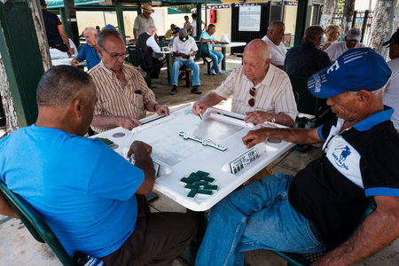 Miami, Florida USA - July 22, 2019: Elderly individuals play the domino game in the historic Domino Park in popular Little Havana.のeditorial素材