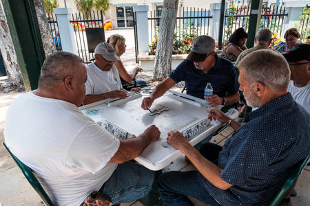 Miami, Florida USA - July 22, 2019: Elderly individuals play the domino game in the historic Domino Park in popular Little Havana.のeditorial素材