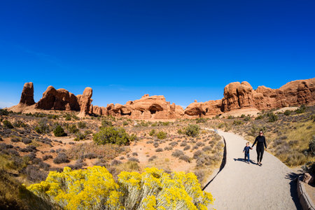 Moab, Utah USA - October 19, 2019: Tourists enjoying the natural beauty of the Double Arch in Arches National Park.のeditorial素材
