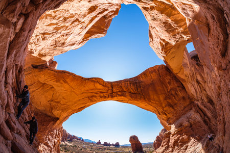 Moab, Utah USA - October 19, 2019: Tourists enjoying the natural beauty of the Double Arch in Arches National Park.のeditorial素材