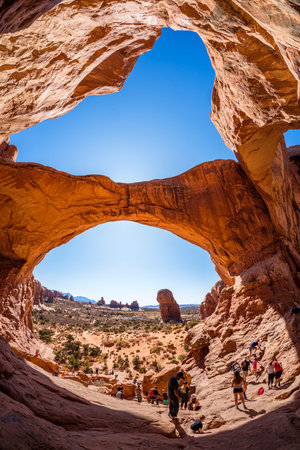 Moab, Utah USA - October 19, 2019: Tourists enjoying the natural beauty of the Double Arch in Arches National Park.のeditorial素材