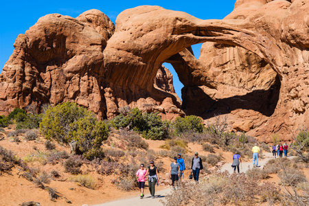 Moab, Utah USA - October 19, 2019: Tourists enjoying the natural beauty of the Double Arch in Arches National Park.のeditorial素材
