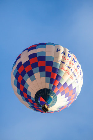 Albuquerque, New Mexico USA - October 5, 2019: Colorful hot air balloon in flight at the famous...