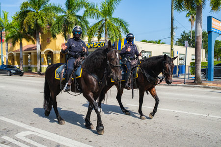 Miami, Florida USA - September 9, 2021: City of Miami police officers on horseback patrolling historic Calle Ocho in Little Havana.のeditorial素材