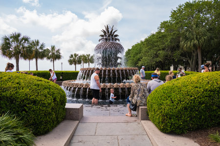 Charleston, South Carolina USA - May 3, 2022: Visitors enjoying bathing in the fountain of the popular Joe Riley Waterfront Park in the historic downtown district.のeditorial素材