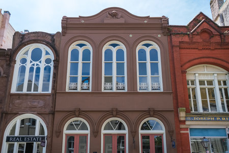 Charleston, South Carolina USA - May 3, 2022: Vintage retail commercial buildings located in the historic downtown district on Broad Street.のeditorial素材
