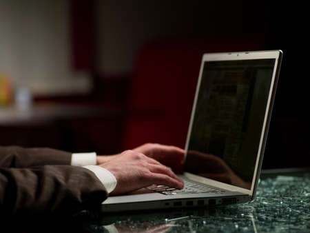 the hands of men in front of computer