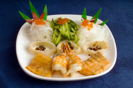 fish and red caviar on a plateの写真素材