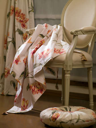 interior of the apartment with a carved chair in the foreground, which is blindの写真素材