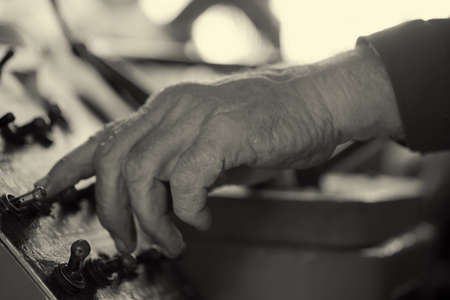 hands working on the remote controlの写真素材