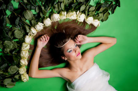 portrait of a pretty girl on the green backgroundの写真素材