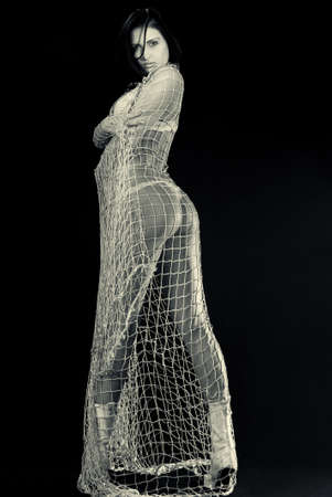 beautiful naked woman in a gridの写真素材