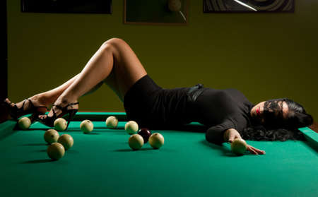 beautiful woman wearing a hat in the billiard club