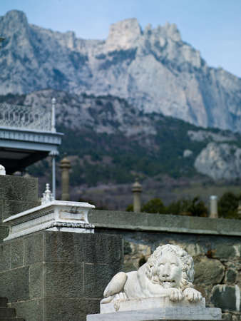 The ancient monument of a lion in the palace on a background of mountainsの写真素材