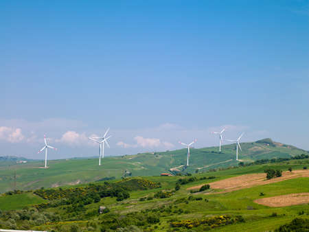 wind farms in Italy against the blue sky and natureの写真素材