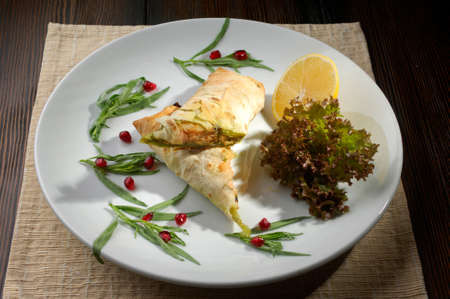 dish out the dough and meat and lemon on a plateの写真素材