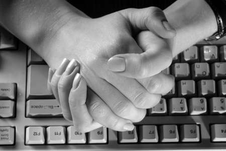 Women's gentle hands typing on a keyboardの写真素材