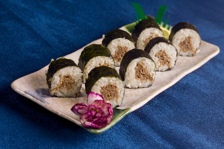 Japanese dish eating sushi with chopsticks on a plate is linedの写真素材