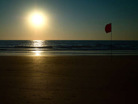 ocean beach with island and palm treesの写真素材