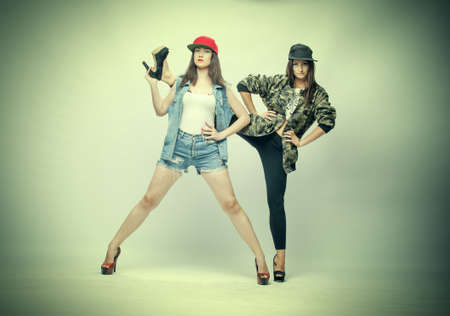 photograph of two beautiful girls on the set of models in studioの写真素材