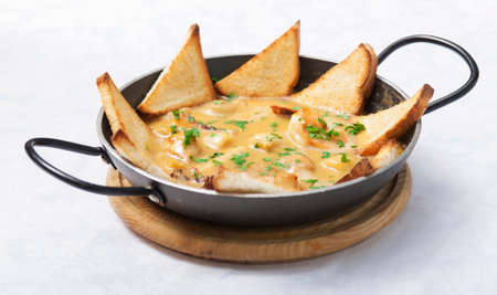 Photo preparation of hot meals with seafood chips and toastの写真素材