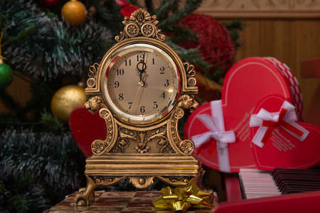 Photo of small desktop clock that show Christmas timeの写真素材