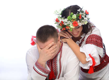 Photo of man and woman in the Ukrainian costume on white backgroundの写真素材