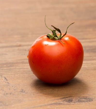 beautiful red ripe tomatoes on a white background closeup
