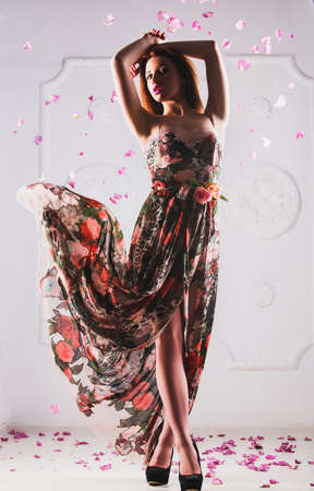 Photo of a beautiful teen girl in the studio shooting on variety of imagesの写真素材