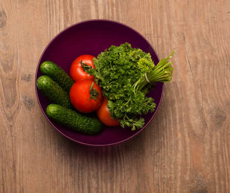 tomato cucumber dill in a deep plateの写真素材