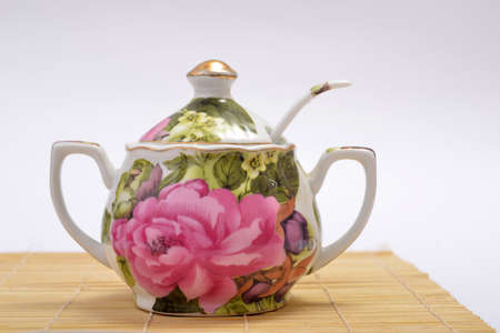 Porcelain sugar bowl standing on white backgroundの写真素材