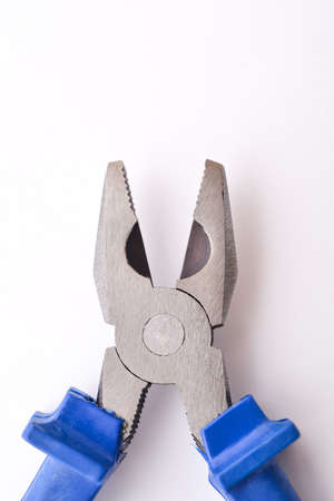 Pliers with blue handles on a white backgroundの写真素材