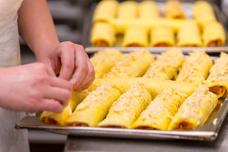 Female hands and pancakesFemale hand and a tray of pancakes.