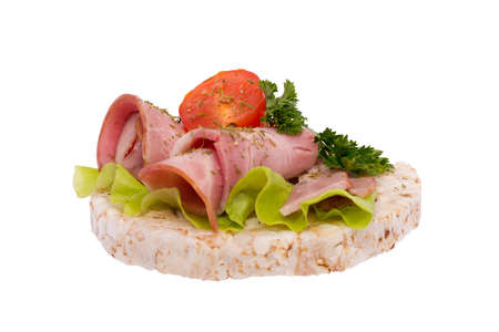 Sandwich with sausage and herbs on breadの写真素材