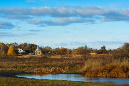The lake on the outskirts of the village and the churchの写真素材