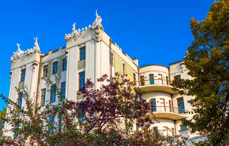 Architecture of the house with chimeras against the blue sky in Kiev.Ukraineの写真素材