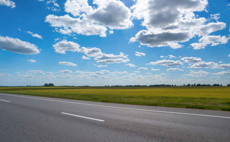 Autobahn in the background of a blue sky with cloudsの写真素材