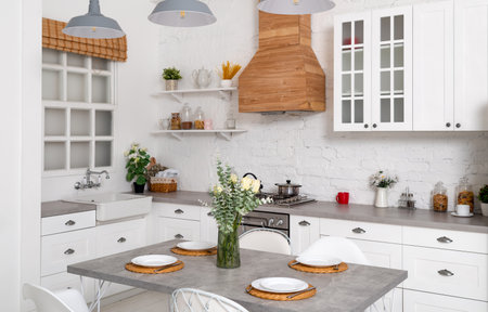 Light kitchen interior with flowers.