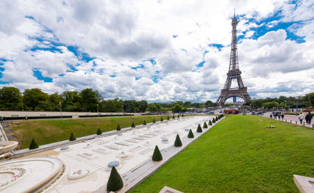 Panorama of Paris with a view of the Eiffel Tower against the blue sky.