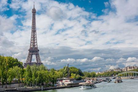 Eiffel Tower in Paris against the background of clouds.のeditorial素材