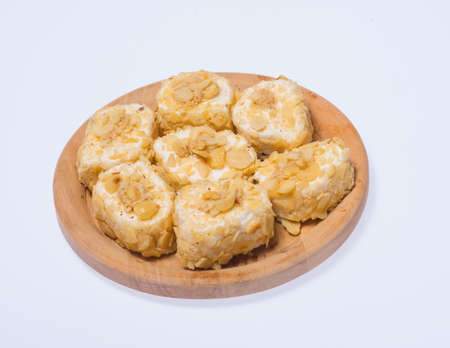 Turkish delight sweets on a wooden stand on a white background.の写真素材