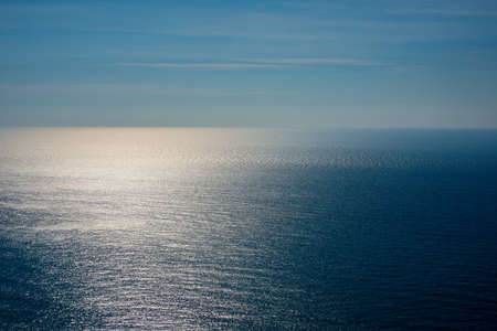 Blue sky with beautiful clouds on the background of the sea.