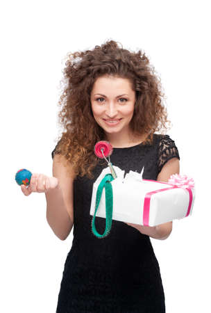 Young woman and body massage device on a neutral white background.の写真素材