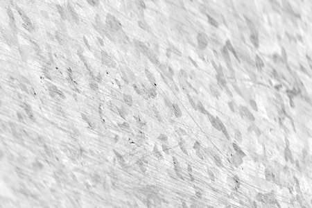 The texture is gray with dark spots.