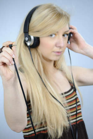 girl selecting musicの写真素材