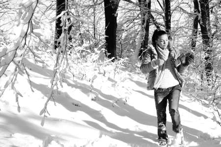 girl resting in forest in winter seasonの写真素材