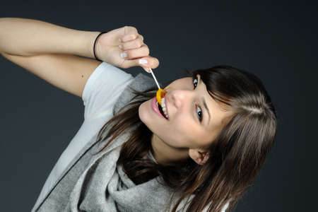 funny teenager eating sweetsの写真素材